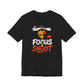 Black Focus & Shoot t-shirt with grunge camera design and orange urban street art aesthetic
