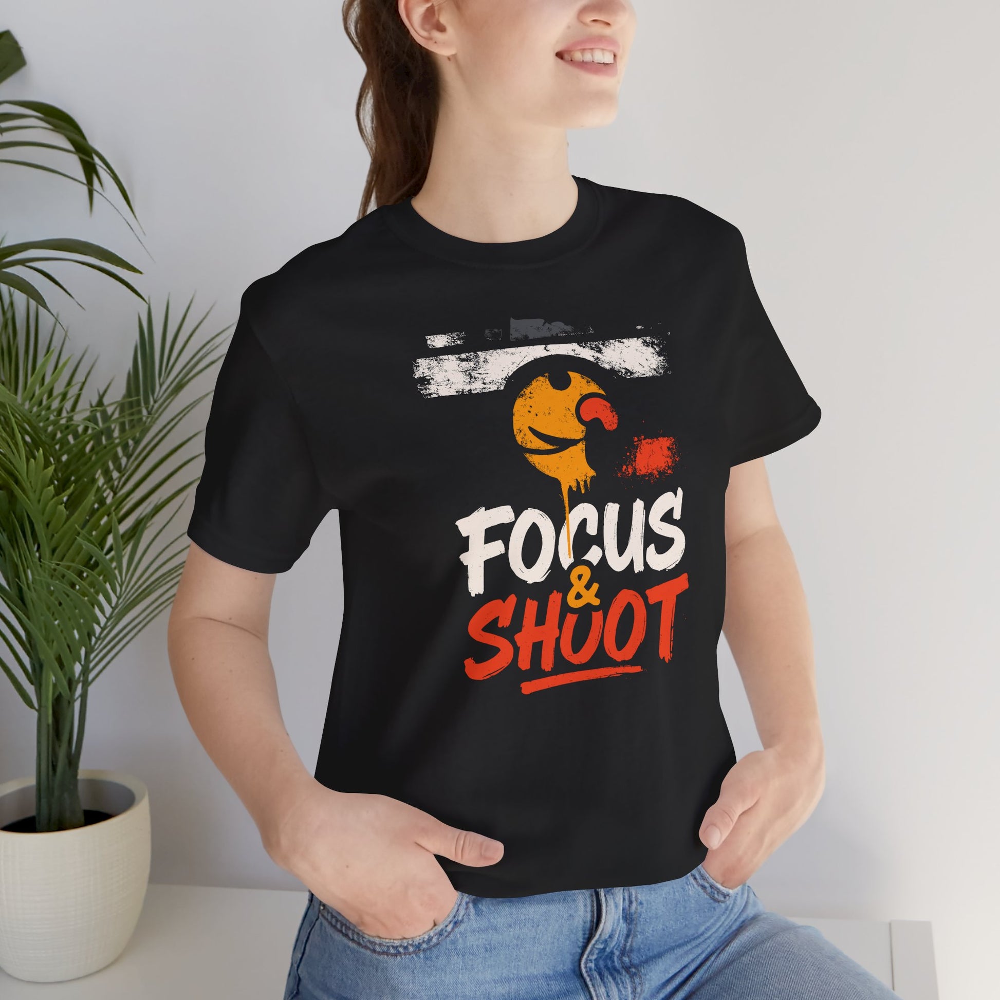 Black Focus & Shoot t-shirt with grunge camera design and orange urban street art aesthetic