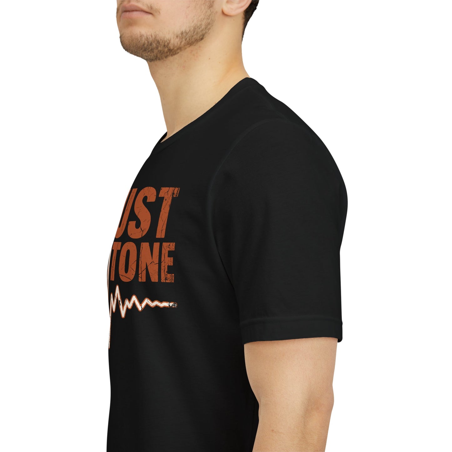 Black t-shirt with red and white text worn by a person on a white background